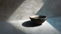 Minimalist ceramic bowl with dramatic shadows and natural lighting on textured stone surface – digital art for Samsung Frame TV